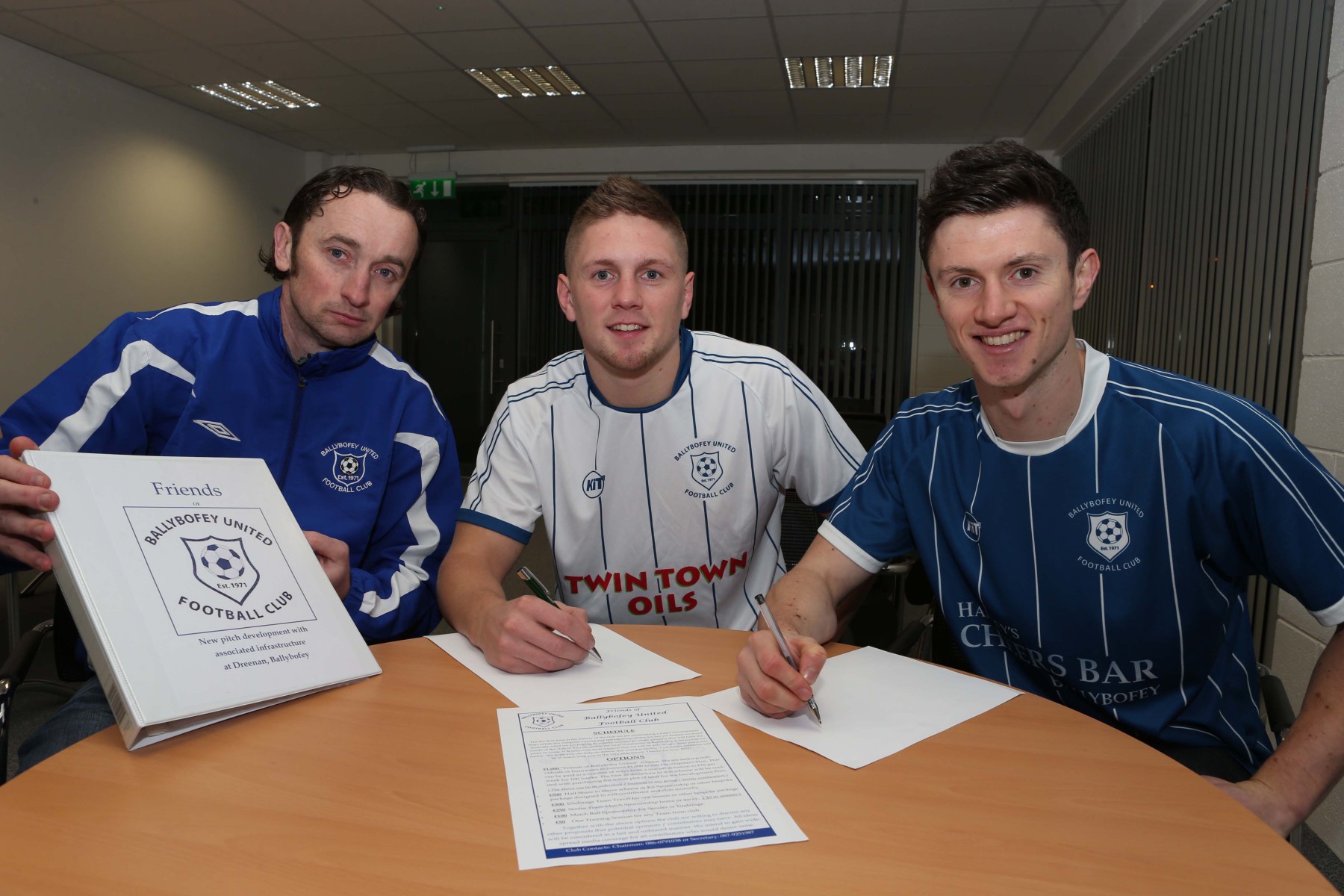 Jason Quigley and Johnny Dunleavy pictured signing up to the "Friends of Ballybofey United" scheme. Included is Senior team manager PH Bonar.